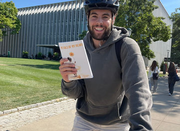 Man holding a poetry book 
