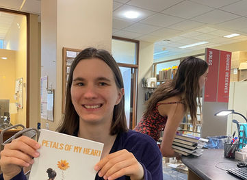 Woman holding a poetry book for healing