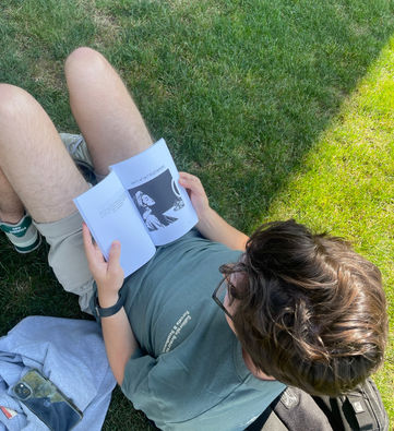 Person reading a poetry book