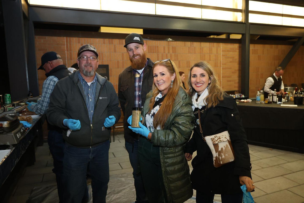 A group of people holding seasoning