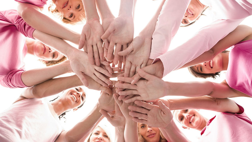 Diverse women smiling in circle wearing