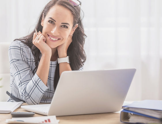 Pretty businesswoman smiles at the camer