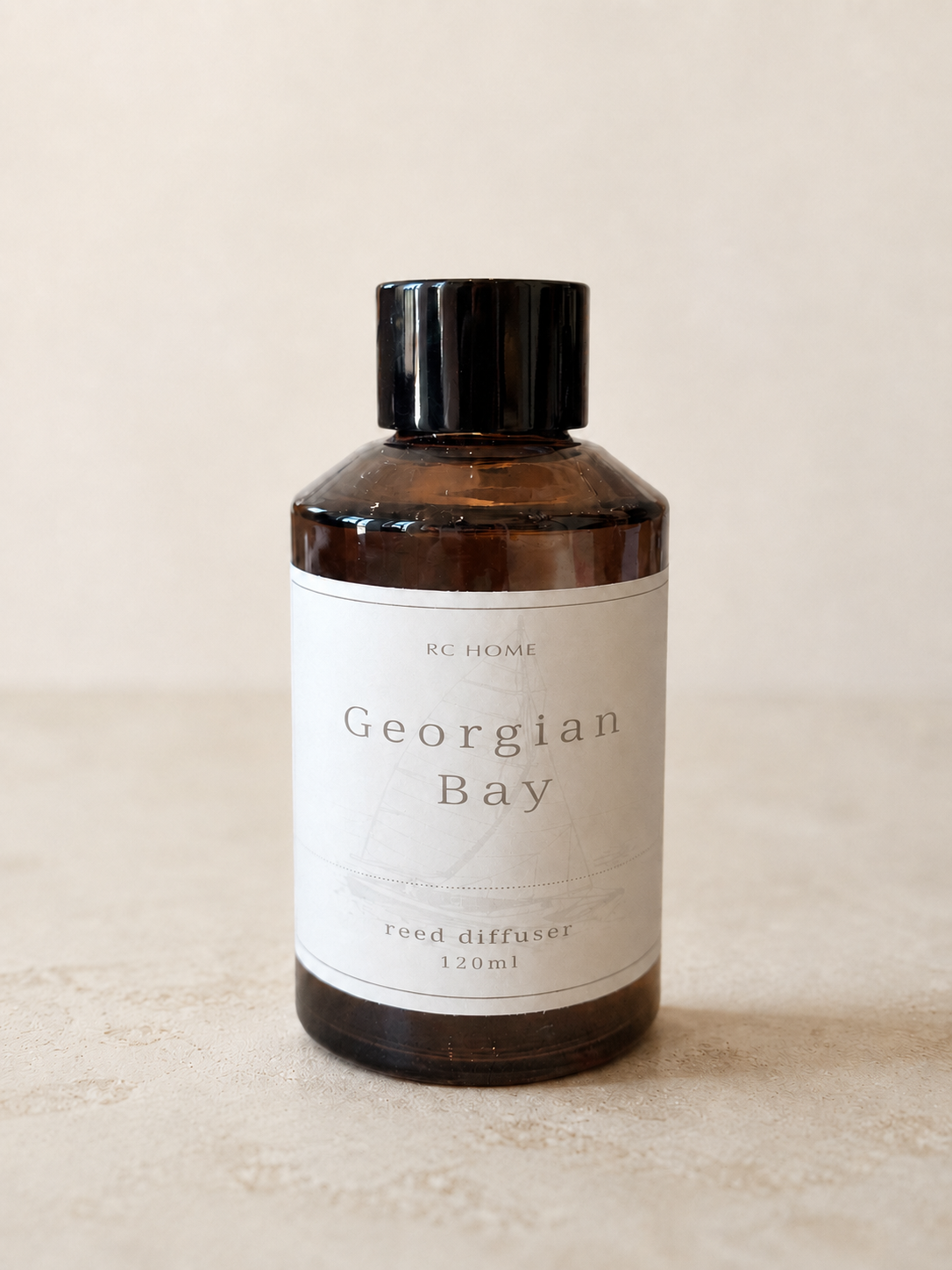Georgian Bay reed diffuser in an amber glass bottle.