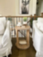 Round wooden console table with decor