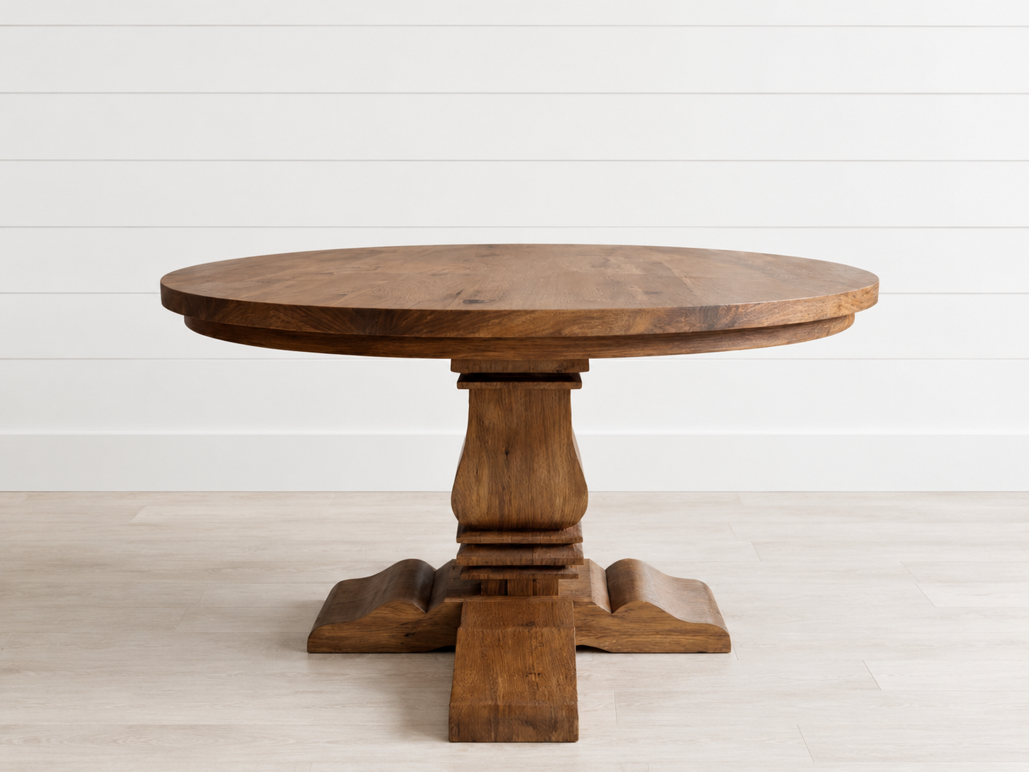 Amaryllis Round Dining Table in a warm wood finish.
