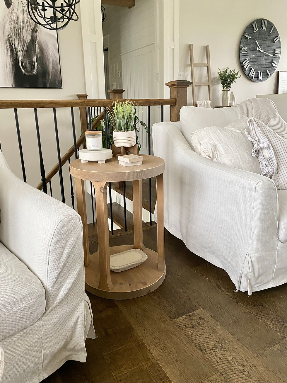 Rustic round console table with plants and candles