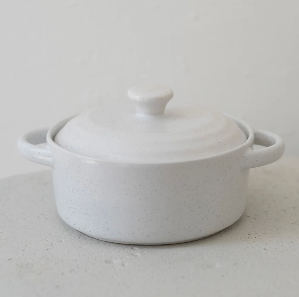 White ceramic pot with lid and handles; matte natural butter crock on white backdrop.