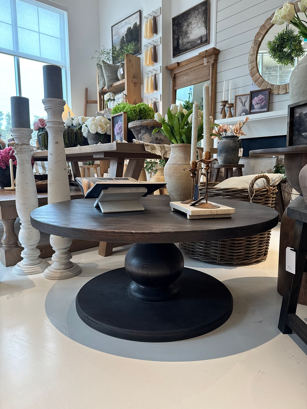 Dark wood round coffee table with pedestal base