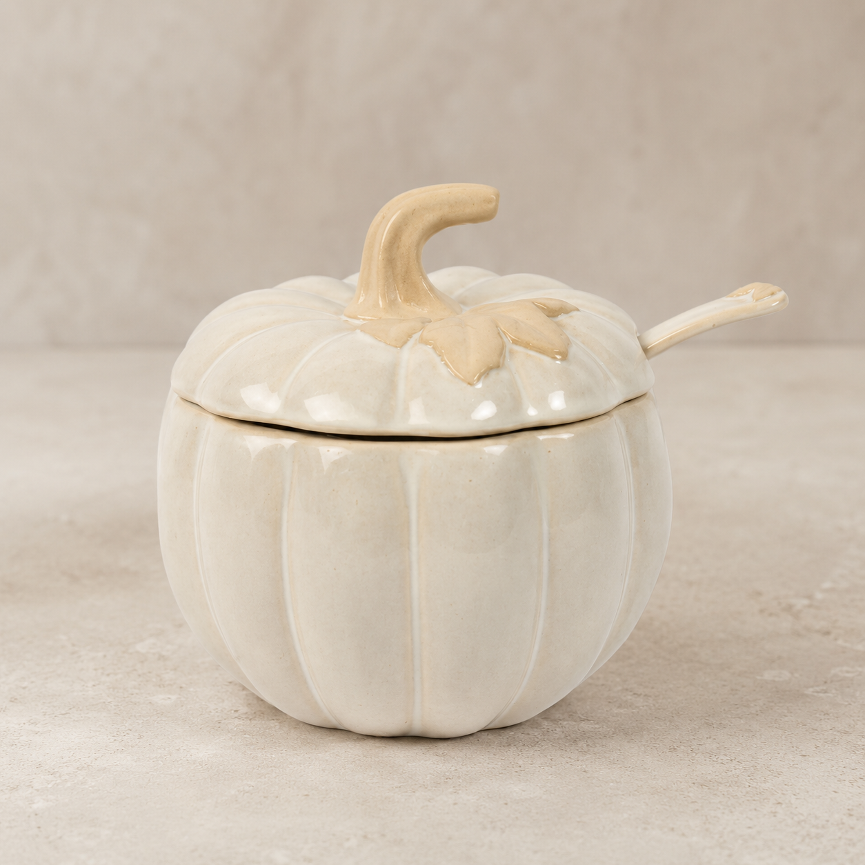 White ceramic pumpkin covered jar with matching spoon