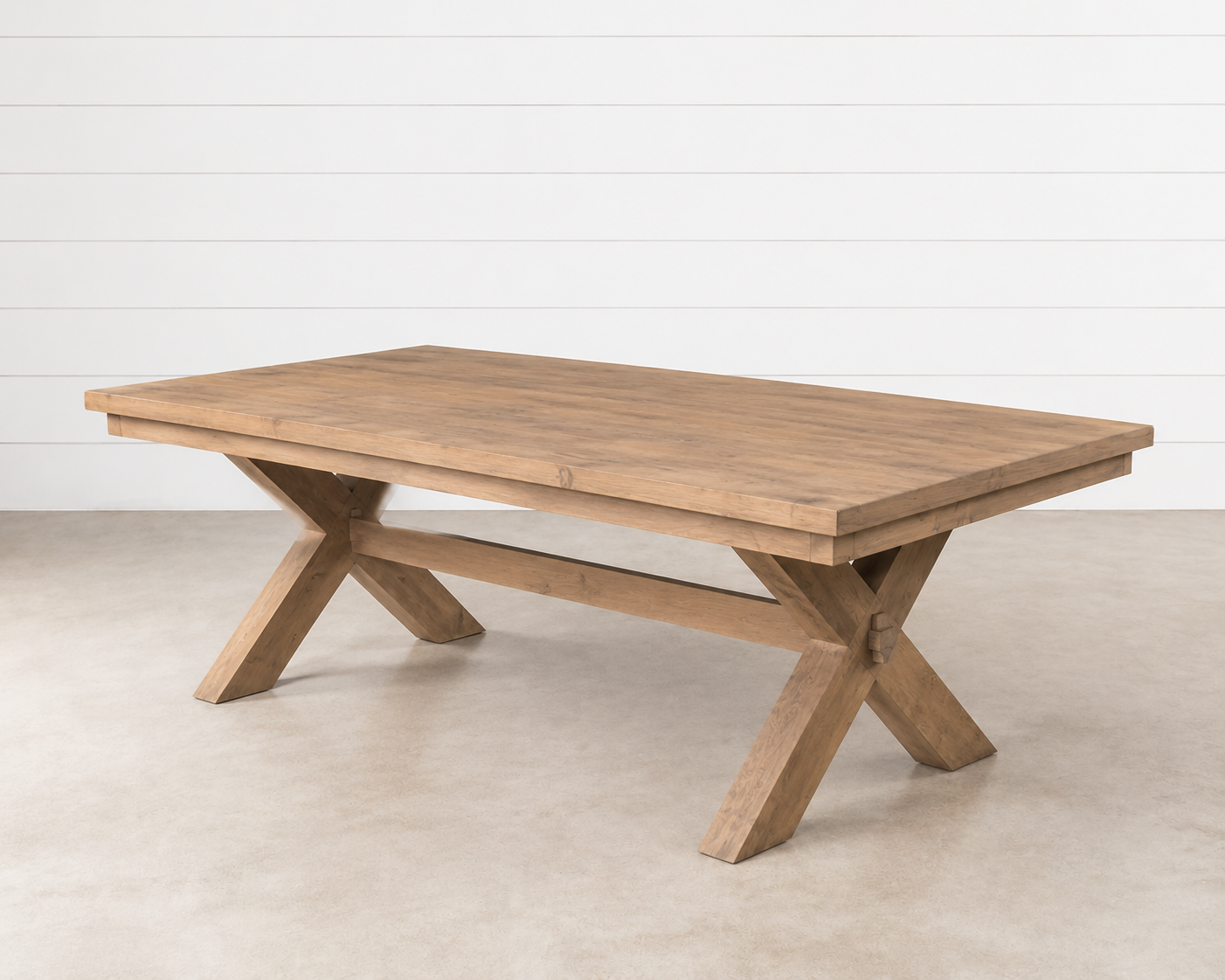 Emery Dining Table with rustic wood finish and X-base.
