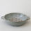 Thumbnail: Grey stoneware fruit bowl with holes, ready for food preparation, on white background.