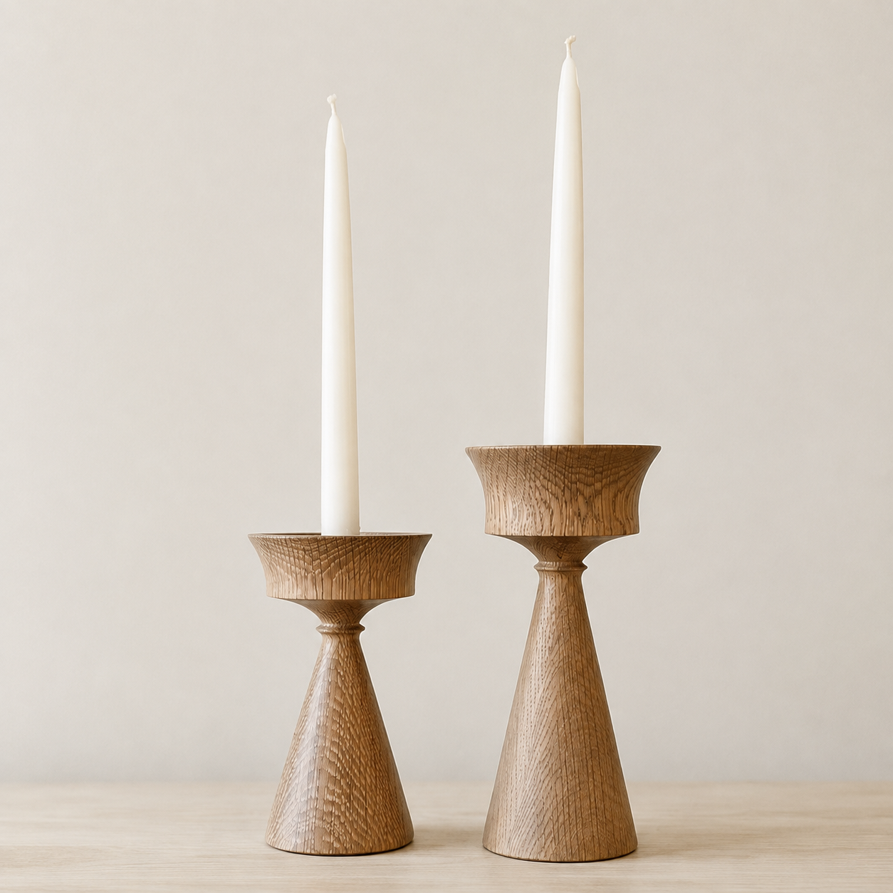 Two White Oak candle holders with tapered candles.