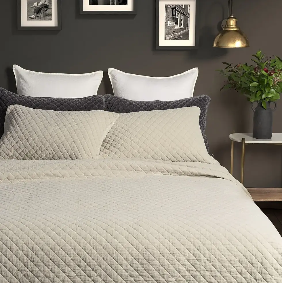 Cozy bed with pillows and comforter, comfortable bedroom and home decor.