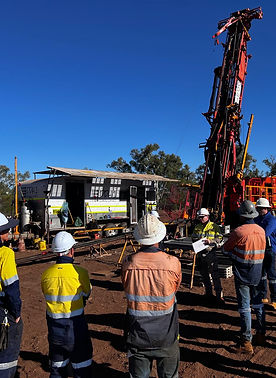 Rig talk at a gold exploration site in The Pilbura, infront of a diamond rig