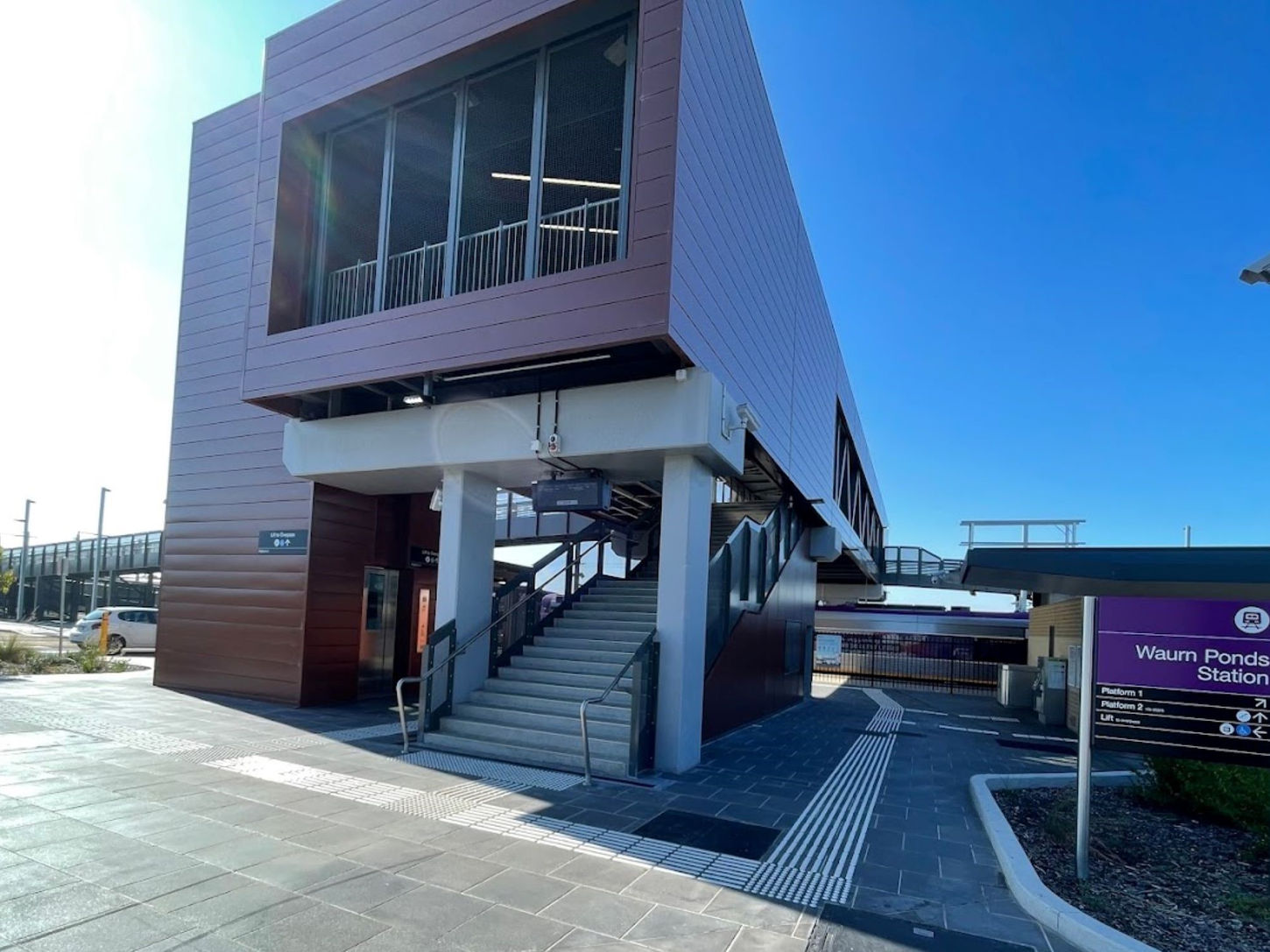 Warun Ponds Station and Footbridge — station exterior showing the platform, canopy and surrounding landscape