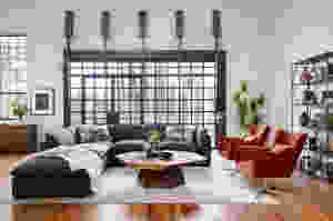 Four Hands Living Room with sectional and orange chairs