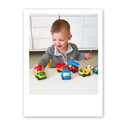 Brady playing with toys