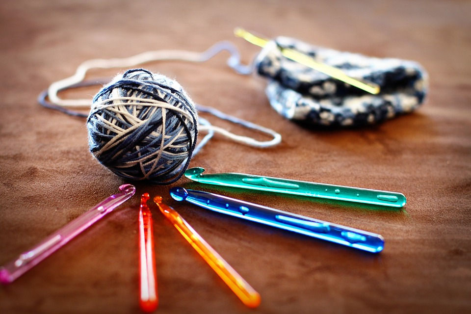 ball of yarn and crochet hooks