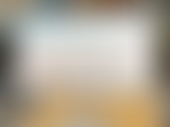 Computer screen displaying a website with a beach scene, featuring a starfish and waves. Text reads "Coastal Calm Made for Everyone."