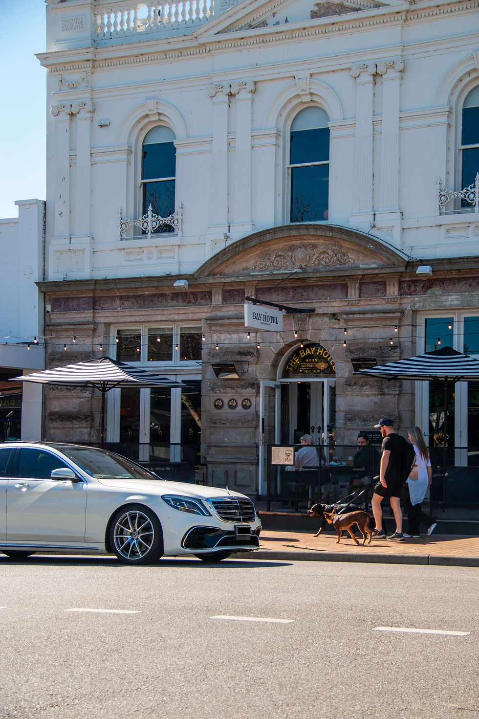 Luxury car waiting at Melbourne Airport arrivals for a door to door Mornington Peninsula pickup