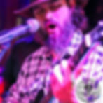 Live music an with beard playing guitar and singing at scallywags where to see live music danang vietnam events in danang Scallywags Sports Bar Danang best sports bar Danang live sports Danang Western breakfast Danang live music Danang public holiday celebrations Danang movie nights Danang happy hour Danang family-friendly bar Danang non-smoking bar Danang air-conditioned bar Danang outdoor patio