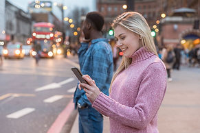 A woman exploring London, UK with the Driftscape tourism platform