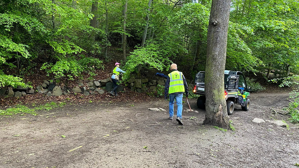 Mandy and Roger keeping clear of the gator as it turns around to reverse up to drop off gravel