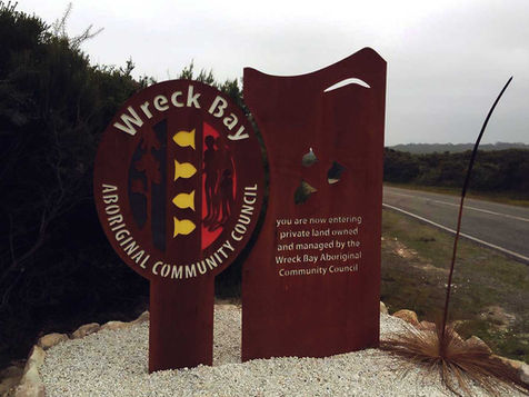 A corten steel entry sign for the Wreck Bay Aboriginal Community Council. 