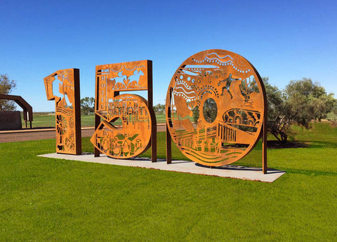 Custom designed corten steel structure featuring detailed laser cut outs of indigenous and heritage designs, installed in Roebourne, Western Australia.