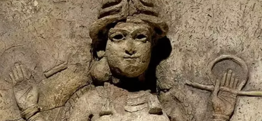 Ancient stone relief carving of a human figure with raised hands and a circular object beside the head.
