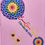 Thumbnail: Pink background rainbow mandala baby rattle zoomed in