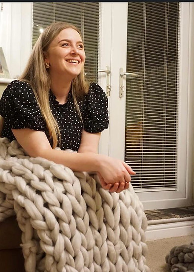 lady arm yarning blanket smiling