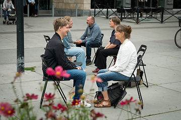 People sitting in the street eye gazing