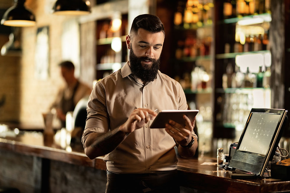 smiling-barista-using-digital-tablet-while-working-bar.jpg