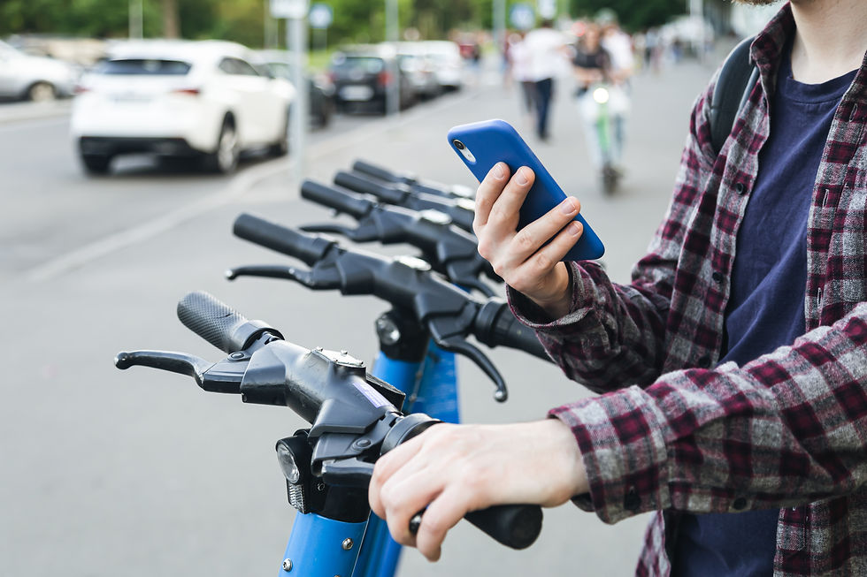 close-up-man-hand-using-mobile-app-rental-electric-scooter.jpg