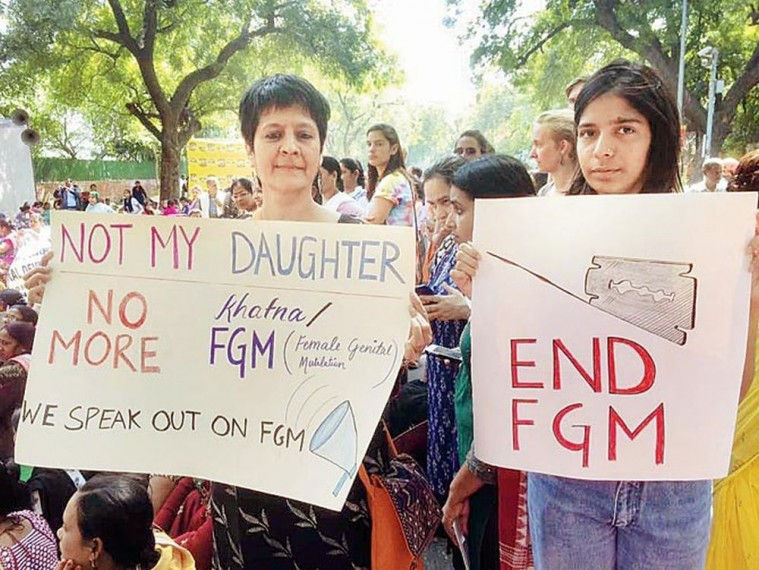 Protesters carrying posters on International Day of Zero Tolerance for Female Genital Mutilation, February 2019. [Image credit: Outlook India]