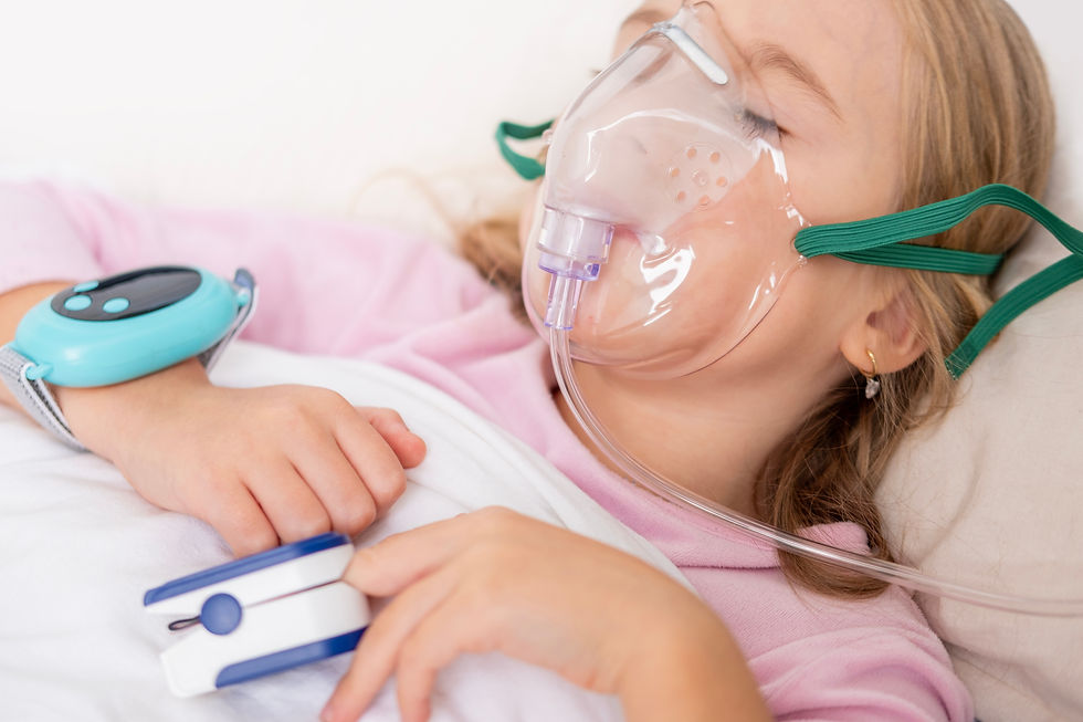 Young person, girl receiving oxygen therapy, Child lies with oxygen mask and pulse oximete