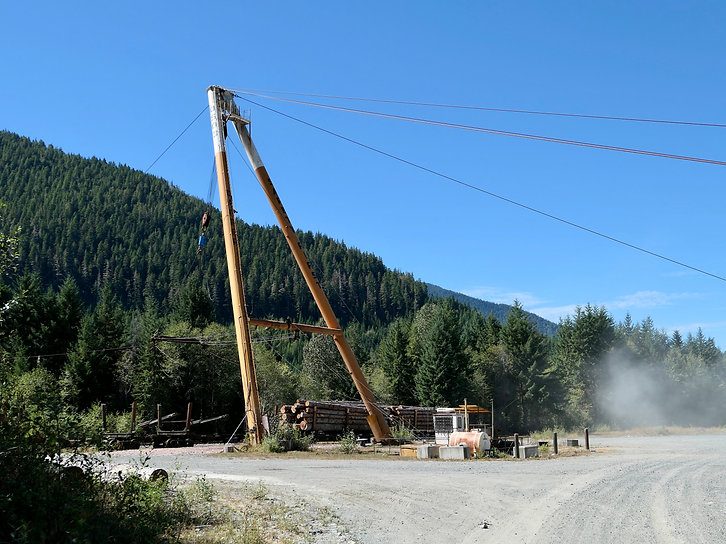Maquillard rail yard, huge spars for loading / unloading rail cars. Bikepacking and cycle touring on the backroads near Woss, north Vancouver Island