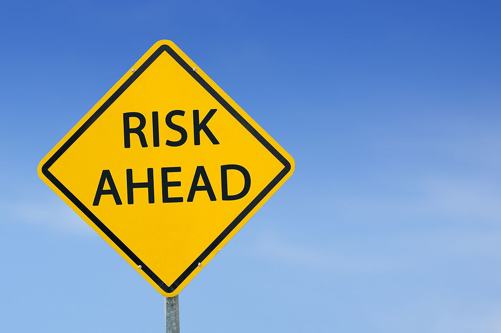 Yellow traffic sign _Risk Ahead_ on the sky background.jpg