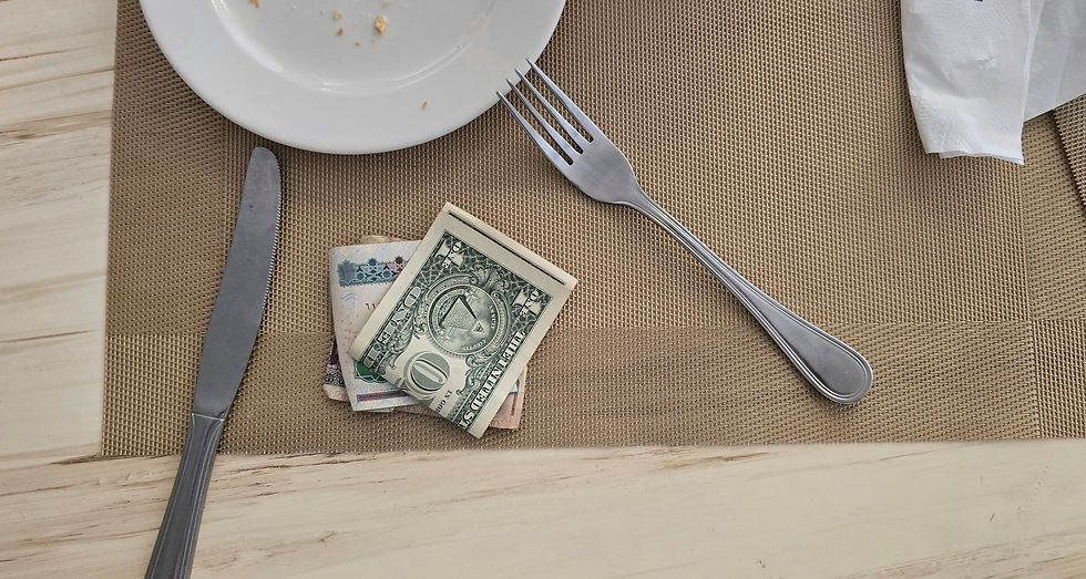 Euro banknotes left as a tip on a restaurant table in Spain