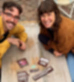 Two smiling people with patches, Generation Soil text, outdoors, happy moment.