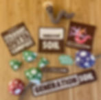 Generation Soil x Rebel Patch sew on patches on wooden table surrounded by handmade mushrooms and crochet worm