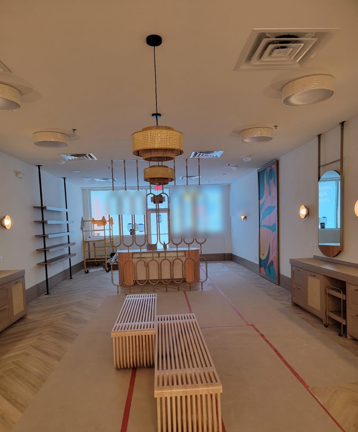 Retail buildout with pendants and sconces