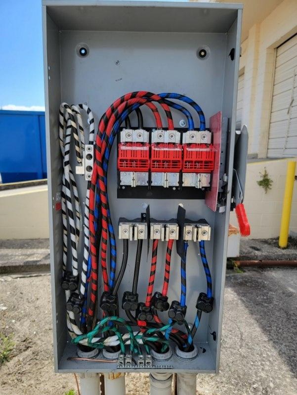 After: new disconnect with new fuses and phase-taped conductors