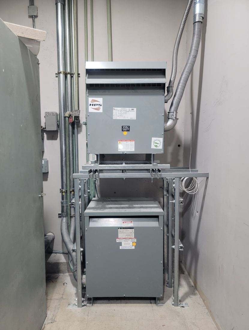 Stacked transformers in an electrical room