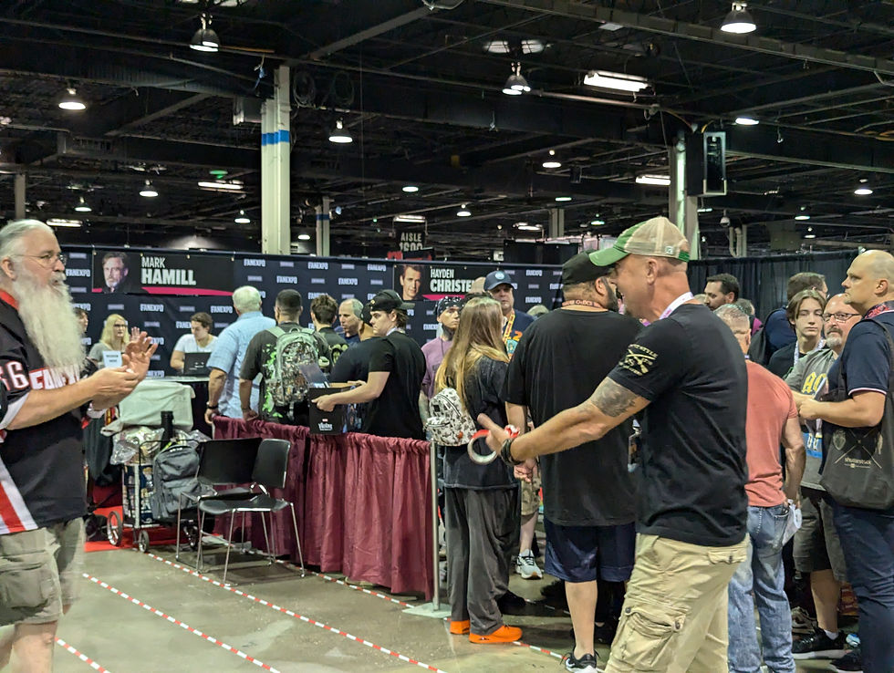 line of convention goers