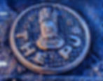 cartoon logo of a man with big hair, a mustache, and a cigar with text underneath saying The PJs