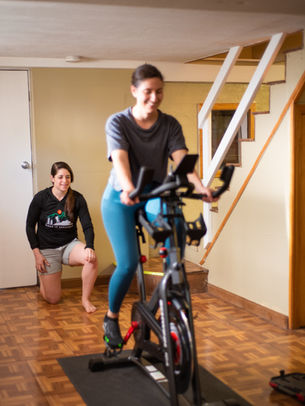 Physical therapist performing a professional bike fit for stationary bikes