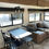Thumbnail: Interior view of RV featuring table, chairs, couch, and windows. LOCAL RV DEALERSHIP