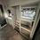 Thumbnail: Interior of a modern RV bedroom with a bed and closet LOCAL RV DEALERSHIP